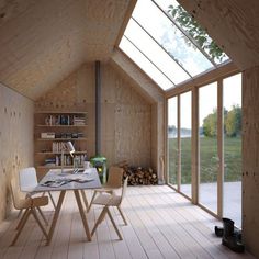 a room with wooden walls and large windows