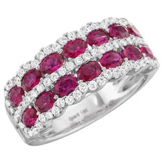 Add color to your jewelry with a ring you can wear everyday! Oval rubies are prong set along two rows, with round diamonds along the center and scalloped edges, make this a colorful take on a classic design. Rubies and diamonds are some of the hardest gemstones, and their durability makes them perfect for jewelry to put on and keep on day after day. Made in USA Also available in 18K Yellow Gold or Platinum Round Diamonds = .51 carats tw G-H Color / VS1-2 Clarity 14 Oval Rubies = 2.10 carats tw M Ruby Diamond Rings, Unique Diamond Rings, Jewelry Appraisal, Bridal Ring Sets, Ladies Diamond Rings, Round Diamond Engagement Rings, Ruby Jewelry, Ruby Diamond, Stackable Ring