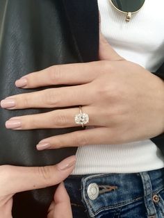 a woman's hand with a ring on it