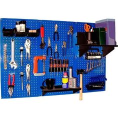 a blue pegboard with tools hanging on it