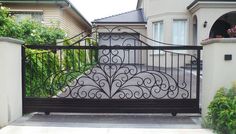 an iron gate in front of a house