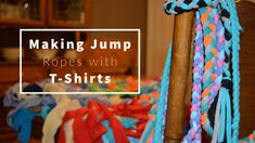 a pile of colorful ropes sitting on top of a wooden chair next to a bed