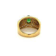 Vintage tsavorite and diamond cluster ring in 18k solid gold. Featuring a richly colored oval cut green and round cut diamond side stones. Mounting in a two-toned solid gold setting.   Tsavorite is a rare form of Garnet called Green Grossularia.   Item Details: - Type: Vintage Ring  - Metal: 18K White, Yellow Gold  - Weight: 12.2 grams  - Setting: Prong  - Size: 8  _____________________________  Center Stone Details: - Type: Tsavorite  - Carat: 1.50 (approx.) - Cut: Oval  - Color: Green  - Measu Luxury Green Oval Cluster Ring, Oval Tsavorite Multi-stone Ring, Oval Multi-stone Tsavorite Rings, Oval Tsavorite Diamond Ring For Formal Occasions, Brilliant Cut Oval Diamond Ring With Tsavorite, Oval Emerald Ring With Pave Setting, Green Oval Cluster Ring Fine Jewelry, Green Multi-stone Oval Diamond Ring, Oval Green Multi-stone Diamond Ring