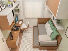 an overhead view of a living room with a couch, desk and bookshelf