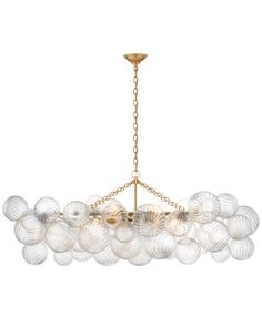 a large chandelier with many balls hanging from it's center point, on a white background