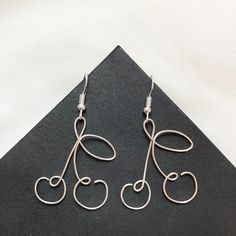 ✦ Perfect earrings for spring and summer (or Harry Styles and Lana Del Rey fans!)  ✦ New & handmade ✦ Handle with delicacy to avoid bending the wire! ✦ Imperfections & plier marks may be visible ✦ Silver/good plated lead & nickel free zinc alloy hooks; 20 gauge wire ✦ Rubber backings included ✦ More jewelry on my shop; message for customs! Square Wire Earrings Diy, Shaped Wire Earrings, Thick Wire Jewelry, Moon Wire Earrings, Wire Bow Earrings, Wire Designs Ideas, Butterfly Wire Earrings, Wire Bending Jewelry, Things To Make With Wire