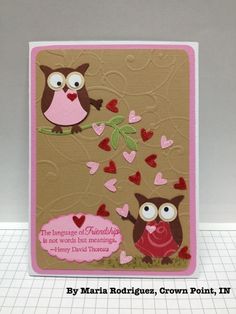 a card with two owls and hearts on it