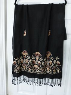 VINTAGE 80s, NEW WITH TAG, LARGE BLACK SCARF/SHAWL/WRAP ---ONE SIZE FITS ALL 78'' X 22'' PLUS 3'' OF FRINGE ON EACH END; SEQUINS DID NOT SHOW UP IN PICS HAS SEQUINS AND BUGLE BEADS ON BEIGE, TAN AND BROWN EMBROIDERY REVERSE SIDE SHOWS EMBROIDERY; VERY VERSATILE FOR YEAR ROUND USE              NON-SMOKING HOME Black Pashmina Shawl For Festive Occasions, Festive Black Shawl With Embroidered Border, Embroidered Black Shawl Dupatta, Embroidered Black Dupatta Shawl, Black Dupatta Shawl, Black Dupatta For Festive Occasions, Black Embroidered Bohemian Shawl, Embroidered Black Shawl For Fall, Black Embroidered Shawl For Fall