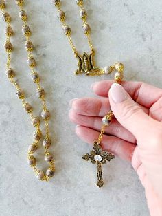 Ponder Mary's Fiat while praying with the lovely Annunciation Rosary. With antique gold plated finishes, an "A" and "M" to represent "Ave Maria", and bohemian glass beads, this is sure to be a keepsake Rosary. Made in Italy antique gold plated finish 8mm beads Out of stock? This item typically restocks in about 4-6 weeks Keep On The Sunny Side, Catholic Candles, A And M, 8mm Beads, Candle Inspiration, Catholic Gifts, Rosary Beads, Beautiful Candles, Catholic Faith