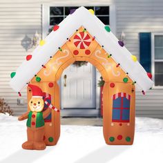 an inflatable gingerbread house is decorated with candy canes