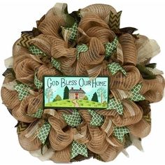 a wreath that says god bless our home