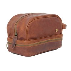 Materials: 100% full grain leather exterior and a waterproof lining interior. Dimensions: 8L capacity. W31cm x H18cm x D15cm (base). Hardware: Brass fittings and robust YKK zippers. Features: Wrist wrap (18cm), two internal pockets and an extra under compartment to keep fragile toiletries safe. External Personalization: Choose your embroidery colour from the dropdown above and enter up to four letters in the box provided.Internal Personalization: Simply enter your message on the 'Special Instruc Leather Wash Bag, Dopp Bag, Boho Tote Bag, Leather Dopp Kit, Classic Purse, Boho Tote, Leather Workshop, Sustainable Leather, Wrist Wrap