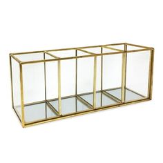 a gold and glass display case with three sections on wheels, one section is empty