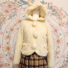 Cream Cat Ear Neko Short Coat Pompom Button Up Snaps Fuzzy Wuzzy, Fuax Fur , Fluffy Texture Pockets Inner Lining Thick Material For Cold Weather Hooded Coat Only From Japanese Harajuku J Fashion Brand Shirly Temple Size/Quality Small Gently Worn I'm In Excellent Condition No Rips Holes Marks Scuffs Shoulders 40cm Bust 42cm Length 47cm Sleeves 60cm #Shirlytemple #Shoujo #Coquette #Gyaru #Egl #Kawaii 1254 Kawaii Hooded Outerwear For Fall, Cute Winter Hooded Jacket, Cute Cream Winter Outerwear, Shoujo Fashion, Coquette Gyaru, Jane Marple, Cream Cat, Fuzzy Wuzzy, Fluffy Texture