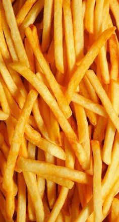 french fries are piled up and ready to be eaten