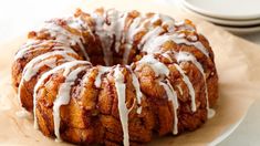 a bundt cake covered in icing on top of a white plate