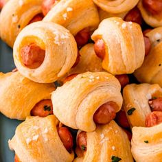 hot dogs wrapped in crescent rolls on a plate