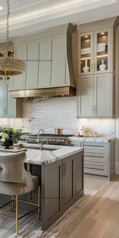 a large kitchen with an island and chairs