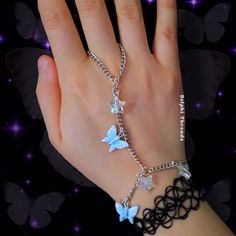 This cute hand chain bracelet has blue butterflies and iridescent star charms The wrist chain length is adjustable between 18-23 cm / 7-9 inches, and the finger loop is about 9 cm in circumference Fairycore Butterfly, Hand Bracelet With Ring, Fairy Grunge Cottagecore, Grunge Cottagecore, Jewelry Y2k, Cottagecore Jewelry, Hand Chain Bracelet, Fairycore Aesthetic, Butterfly Bracelet