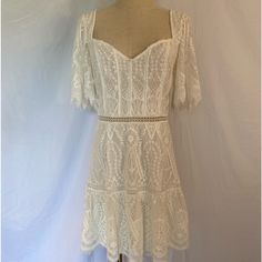 Saylor Zuzanna Mini Dress Size Medium Color: White Excellent Condition Back Zipper, Lace, Lined, Sweetheart Neckline, Flared Flutter Sleeves, Ladder Lace, Eyelet Lace Trim At The Hem This Gorgeous Dress Is So Feminine And Romantic With All The Lace Detail. Perfect For A Bridal Shower, Rehearsal Dinner, Engagement Party, Bachelorette Party, Or Any Other Special Occasion. Wedding, Beach Wedding, Island Wedding, Courthouse Wedding, Las Vegas Wedding Approximate Measurements Laying Flat: Underarm To Underarm: 15” Waist: 14” Top Of Shoulder To Hem Bottom: 34” Urban Outfitters, Free People Wedding Courthouse, Wedding Las Vegas, White Lace Mini Dress, Las Vegas Wedding, Party Bachelorette, Wedding Beach, Courthouse Wedding, Las Vegas Weddings, Island Wedding