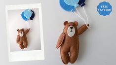 two teddy bears are hanging on the wall with balloons attached to them, and one is holding a blue balloon