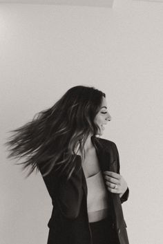 black and white photograph of a woman with her hair blowing in the wind