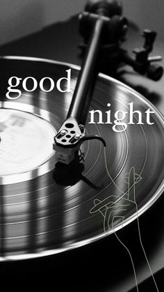 an old record player with the words good night on it