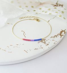 "Subtle Bi Pride bracelet with delicate chain and small beads. Dainty Pride jewelry. This bracelet is dainty and beautiful: a subtle way to express your pride in everyday life. This listing for one bracelet. On the 1st image is shown bracelet version #7. All versions are available in gold tone or silver tone. **SHOP DISCOUNTS: 2 items 10%, 3 items 15%, 4+items 20% off** DETAILS - Japanese glass seed beads - Dainty but strong chain - Two stoppers preventing glass beads from sliding on the chain - Subtle Bisexual Jewelry, Bisexual Bracelet, Bisexual Jewelry, Bi Flag, Pride Jewellery, Pride Bracelet, Gold Chain Jewelry, Small Cards, Matching Necklaces