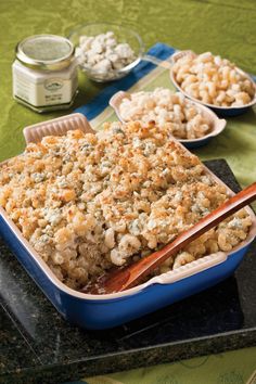 there is a casserole dish with rice and other food items on the table