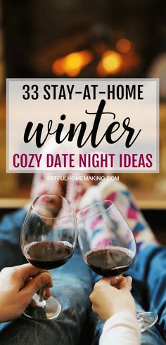 two people holding wine glasses with the words 33 stay at home winter cozy date night ideas