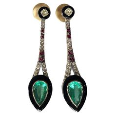 A very gorgeous and special, Art Deco style, Emerald, Black Onyx & Ruby Drop Chandelier Earrings set in 18K Yellow Gold & natural Diamonds. The weight of the Emeralds is 3.85 carats. The Emeralds are completely natural, without any treatment and are of Zambian origin. The weight of the Black Onyx is 3.70 carats. The weight of the Rubies is 0.30 carats. The Diamonds weight is 0.87 carats. Net 18K Yellow Gold weight is 12.39 grams. The Gross weight of the Earrings is 14.13 grams. The dimensions of the Earrings are 5.50cm x 1.50cm x 0.60cm (L x W x D). The Earrings have a push back. ✦ Handmade / Handcrafted Fine Jewelry ✦ Gemstone: natural Zambian Emerald ✦ Gemstone Cut: Pear ✦ Gemstone Weight: 3.85 ct. Approx. ✦ Gemstone: Black Onyx ✦ Gemstone Cut: Custom Cut for this Earring ✦ Gemstone Weig Stile Art, Earring Video, Drop Chandelier, Diamond Chandelier Earrings, Diamond Chandelier, Columbian Emeralds, Diamond Dangle Earrings, Gold Art Deco, Art Deco Earrings