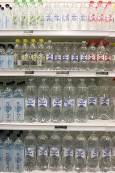 bottled water on shelves in a grocery store