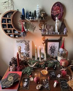 a table topped with lots of candles and pictures