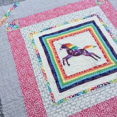 a colorful quilt with a horse on it