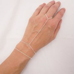 MADE WITH SOLID STERLING SILVER PARTS - A GREAT KEEPSAKEI make this hand chain bracelet using sturdy sterling silver chain and a lobster clasp. Paired in the first two photos with a simple chain bracelet for a layered look. Both can be purchased together as a set or you can purchase just the hand chain bracelet (see 3rd photo). Comes in a gift box, perfect for gift giving. SIZING - IMPORTANT: To determine bracelet size, measure snugly around your wrist and add 1/2 inch to get your bracelet size. Sterling Silver Adjustable Link Bracelet, Minimalist Sterling Silver Chain Bracelet With Extender, Adjustable Link Sterling Silver Bracelet Gift, Adjustable Sterling Silver Link Bracelet Gift, Adjustable Sterling Silver Chain Bracelet Gift, Adjustable Sterling Silver Charm Bracelet, Minimalist Adjustable Sterling Silver Bracelet With Lobster Clasp, Sterling Silver Link Jewelry With Extender, Adjustable Sterling Silver Chain Bracelet Minimalist Style