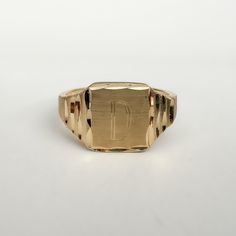 What: A vintage Michael Anthony signet ring engraved with a capital letter D. Why We Love It: We love the diamond cut on the gold. It reflects the light beautifully. We also love the textured gold on the shoulders: Why It's Special: There's something exciting about finding a vintage piece of jewelry with your initial(s) on it. Almost like it was meant for you! Era: c. 1980's Metal: 14K Yellow Gold  Size: Between a 2 3/4 & 3 US on my mandrel, but can possibly be resized with reason. At this time, resizing is not currently offered. It is recommended that you bring it to your local jeweler for accurate resizing. All rings are measured with an industry standard True Size mandrel. If you need more clarity regarding the size of a ring, please reach out. Marking: Ma is stamped on the inside of th Signet Rings Women Vintage, A Capital Letter, Copyright Symbol, Signet Rings Women, Initial S, Michael Anthony, Rings Women, Letter D, Signet Rings