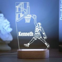 a lamp that has a basketball player on it