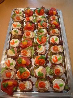 there are many small appetizers on the tray ready to be served for guests