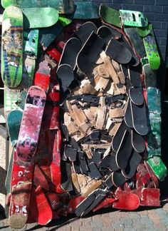 there is a sculpture made out of skateboards