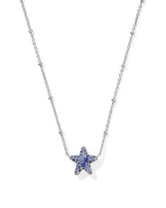 With the Jae Silver Star Pave Short Pendant Necklace in Blue Crystal, your stack has never looked more stellar. Set on a satellite chain, this star-shaped pendant sparkles thanks to its dazzling crystal detailing. Whether you’re rocking a game day fit or amping up an everyday look, this style will make you stand out. Metal Rhodium Over Brass Material Blue Crystal Closure Spring Ring Clasp Size 19" Chain ,0.46"L X 0.53"W PendantDue to the one-of-a-kind nature of the medium, exact colors and patterns may vary slightly from the image shown. | Kendra Scott Jae Silver Star Pave Short Pendant Necklace in Blue Crystal | Crystal/Metal Rhodium Silver Kendra Scott Necklace, Silver Blue Jewelry, Blue And Silver Jewelry, Short Pendant Necklace, Kendra Scott Necklace, Earring Sale, Blue Necklace, Brass Material, Silver Stars