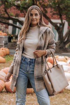 Details Update your outerwear this season with this stylish Taupe Plaid Hooded Open Knit Coat! It's perfect for workwear or any casual occasion. Features long sleeves, an attached hood, open front, side pockets, and an allover plaid pattern. Layer over a neutral basic tank or bodysuit and then pair with your favorite denim jeans, ankle booties, and a trendy tote bag to complete the look. Long sleeve Open front Attached hood Front pockets Plaid pattern Straight silhouette Knit fabric 74% Acrylic, Hooded Fall Outerwear For Cold Weather, Hooded Outerwear For Cold Weather In Fall, Fall Hooded Cardigan With Pockets, Fall Long Coat With Double-lined Hood, Hooded Cardigan With Pockets For Fall, Hooded Fall Cardigan With Pockets, Long Coat With Double-lined Hood For Fall, Cozy Long Coat For Fall, Winter Workwear Hooded Jacket With Long Sleeves