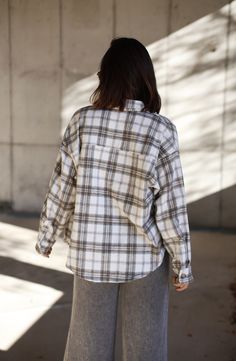 Feel cozy yet classic in this luxe plaid top featuring a collared neckline with button closures and pocket detail for that added touch of sophistication. The rounded hem offers a relaxed fit perfect for any Fall outings like shopping errands, brunch, and even bonfires. A must-have transition piece that is trendy and elevated, this Backroads Bonfire Plaid Top is an essential for any warm and cozy weekend. 90% Polyester 10% Wool Hand wash cold. Fall Outings, Cozy Weekend, Plaid Top, Plaid Tops, Pocket Detail, Dresses Xs, Warm And Cozy, Must Haves, Hand Wash