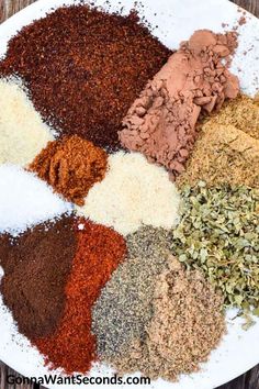 an assortment of spices and seasonings on a white plate with text overlay that reads how to make homemade spice mixes