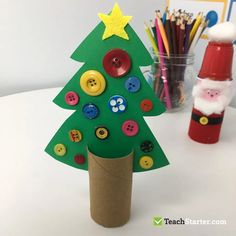 a christmas tree made out of paper and buttons