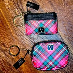 two small purses sitting on top of a wooden table