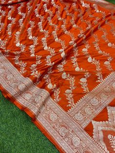 This is a very beautiful high quality mashru silk saree . All over zari motifs design with border . Saree length - 5.5 mtr. Blouse - 1 mtr. Dry clean only . Please note - color may be vary a little due to sunlight and photography . Please message us after purchasing in case you want fall and Pico done it not . No extra charges for fall and Pico but inform us . Blouse stitching is also available . Katan Silk Pre-draped Saree With Motifs For Designer Wear, Semi-stitched Katan Silk Saree With Pallu, Elegant Designer Paithani Silk Lehenga, Orange Saree With Dupatta In Traditional Drape, Diwali Unstitched Dola Silk Suit With Zari Weaving, Orange Saree With Dupatta For Diwali, Elegant Orange Saree For Diwali, Elegant Festive Orange Saree, Elegant Orange Festive Saree