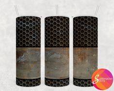 three metal tubes with black and brown designs on them