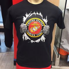 a black t - shirt with the u s marine warrant seal on it's chest