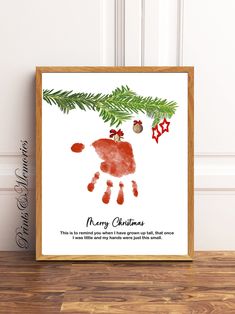 a christmas card with a handprint on it