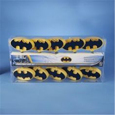 six batman toothbrushes in packaging on a blue background